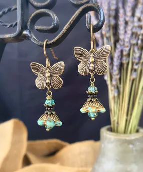 Brass butterfly charms, turquoise Czech glass, flower bead caps, bronze metal, earrings